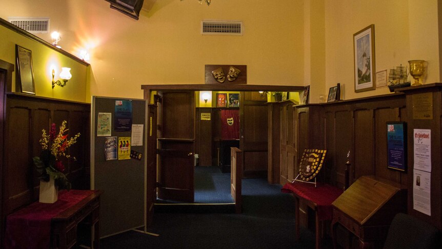 The hall at the theatre shows the building's panelled walls and fittings, 1 August 2014.