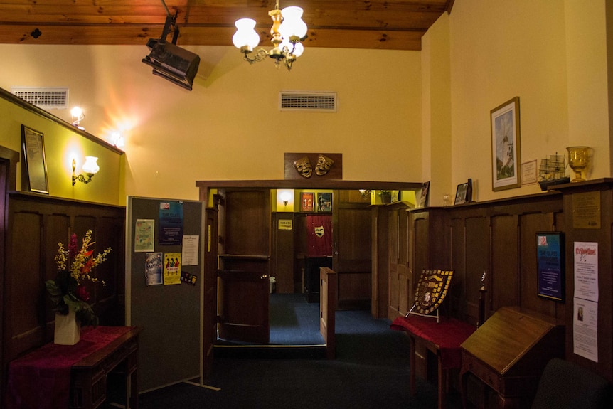 The hall at the theatre shows the building's panelled walls and fittings, 1 August 2014.