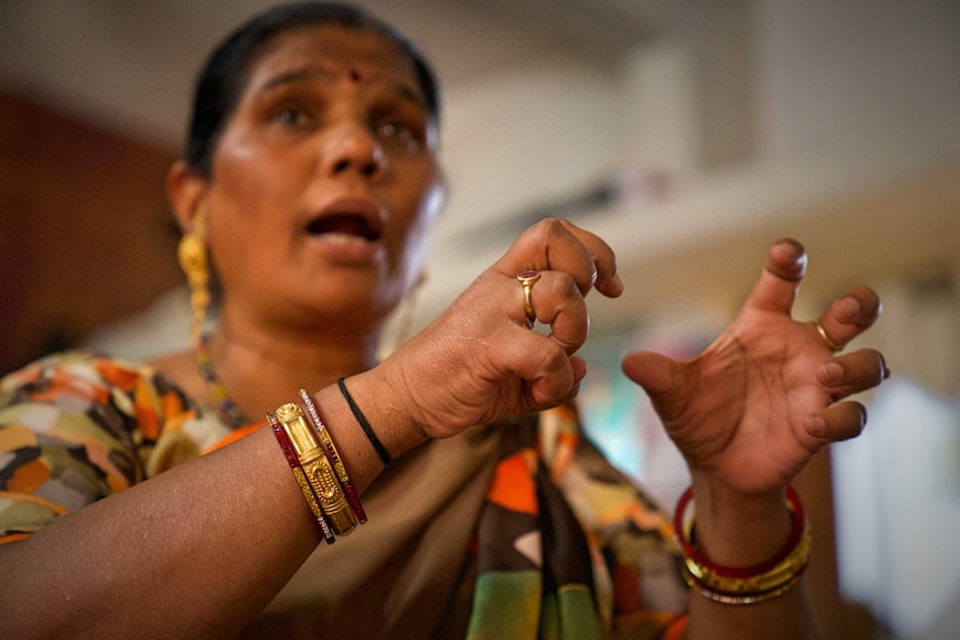 An older female supporter of the group against virginity testing.