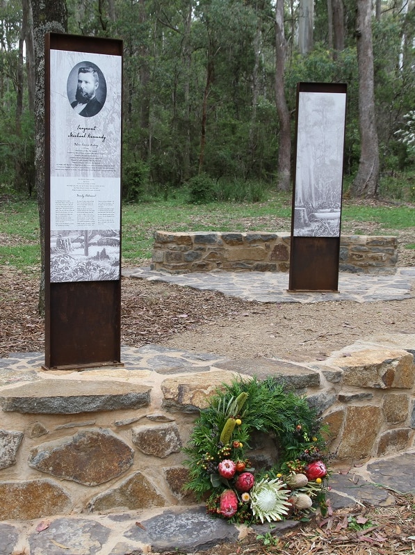 A wreath sits at the bottom of memorial plinth of Victoria Policeman Sergeant Michael Kennedy