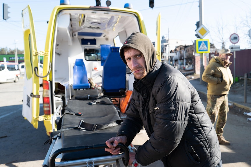 A volunteer medic preparing ambulances for the evacuation of Irpin