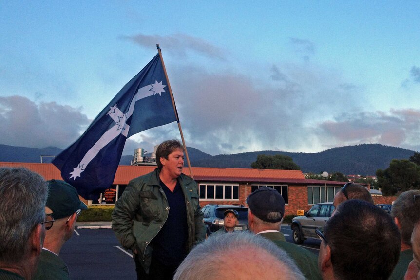 Sam Simonetis from the bus drivers' union speaks to members outside Metro Tasmania headquarters.