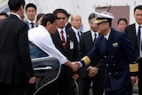 Philippine President Rodrigo Duterte is welcomed by a Japan Coast Guard official.