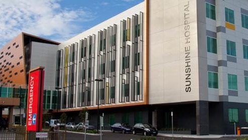 The exterior of Sunshine Hospital, including a sign for its emergency department.