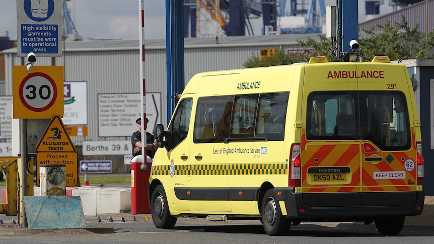 Ambulance arrives at Tilbury Docks to attend to people found in a shipping container