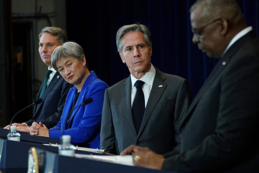 Richard Marles, Penny Wong, Antony Blinken and Lloyd Austin at lecterns 