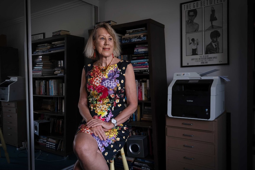 Drummer Lindy Morrison sitting in her study, staring out the window.