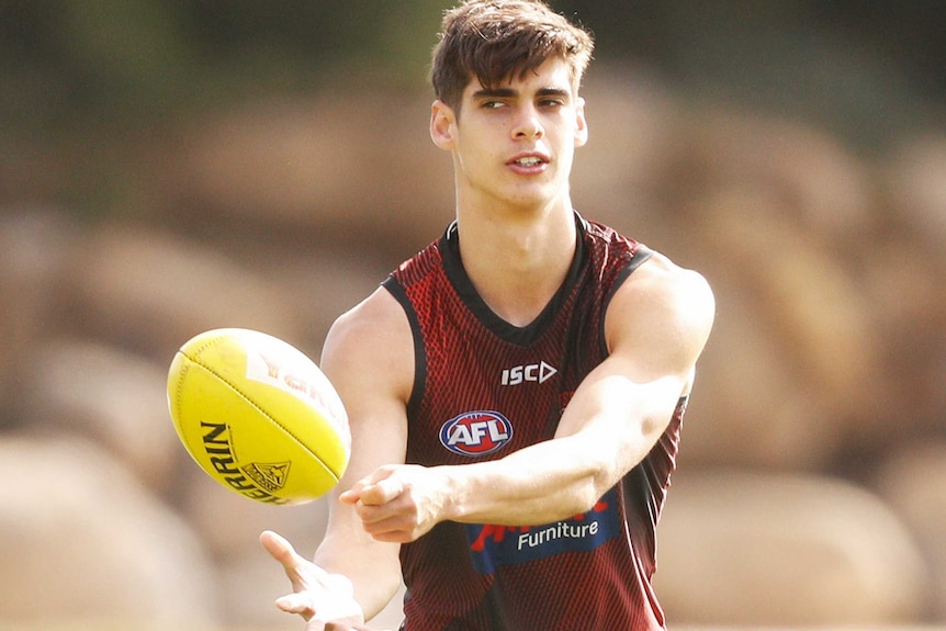 Brandon Zerk-Thatcher handballs at training.