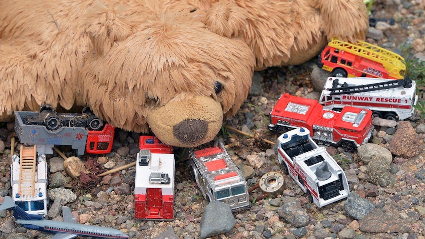 Toys are left at a memorial in Prescott, Arizona for dead firefighters