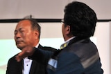 Relative (R) of ferry passenger slaps South Korean government official