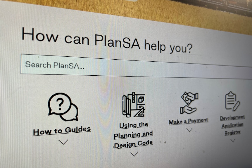 A photo of detail from a website with text reading 'How can PlanSA help you?'