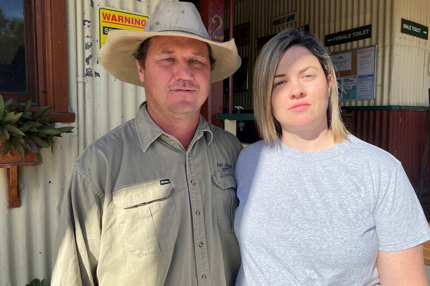 Two people standing outside the Nebo Pub