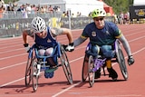 American Stephen Simmons helped by Mark Urquart at the Invictus Games.