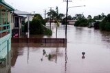 Floodwaters resulting from cyclone Ellie fill the streets of Ingham.