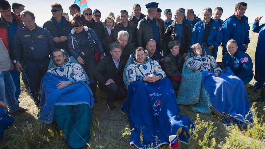 Chris Hadfield, Roman Romanenko and Tom Marshburn recover after landing in central Kazakhstan