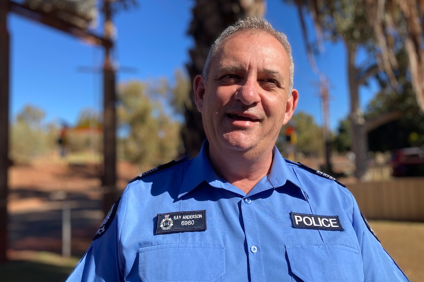 Headshot of a male police officer in uniform 