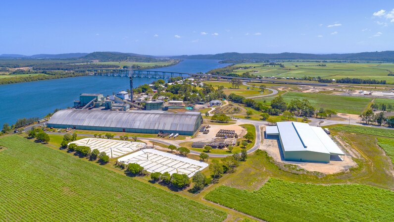 An aerial shot of the Harwood Sugar Mill adjacent to the Clarence River.