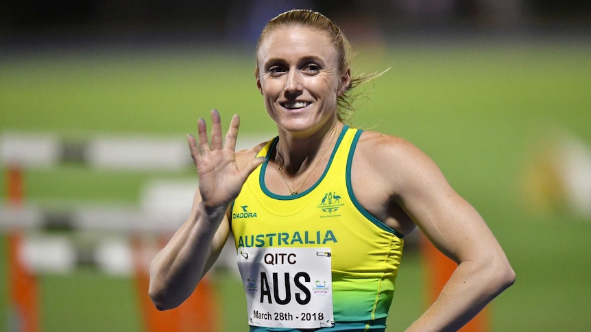 Sally Pearson waves and smiles at the Queensland international Track Classic.