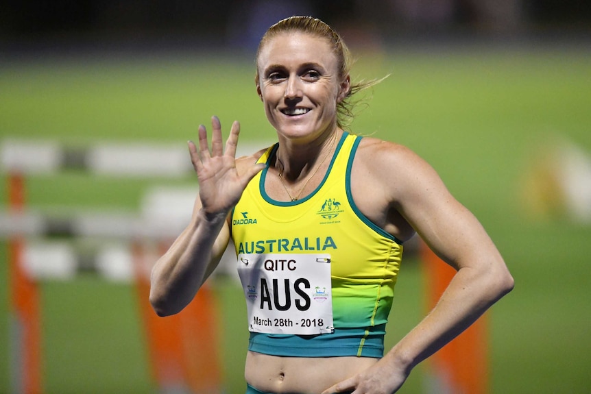 Sally Pearson waves and smiles at the Queensland international Track Classic.