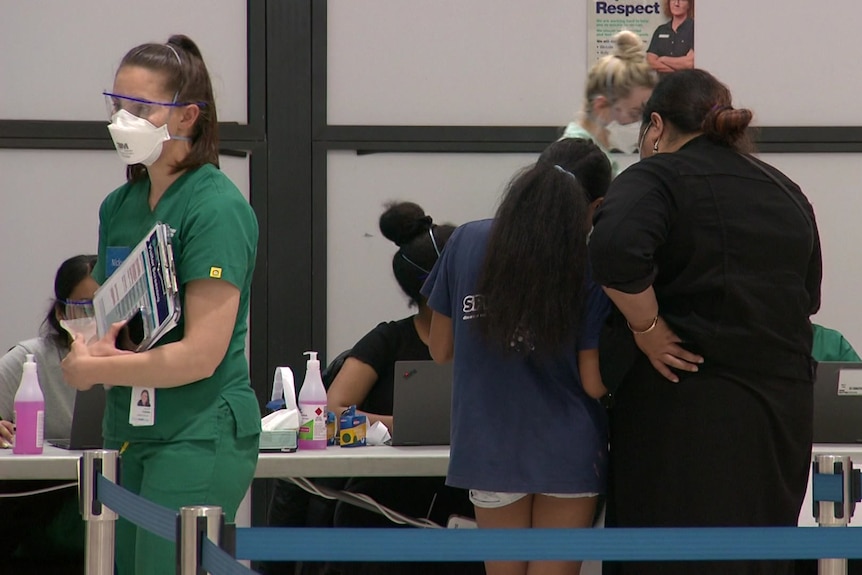 Healthcare workers at a pop-up vaccination hub.