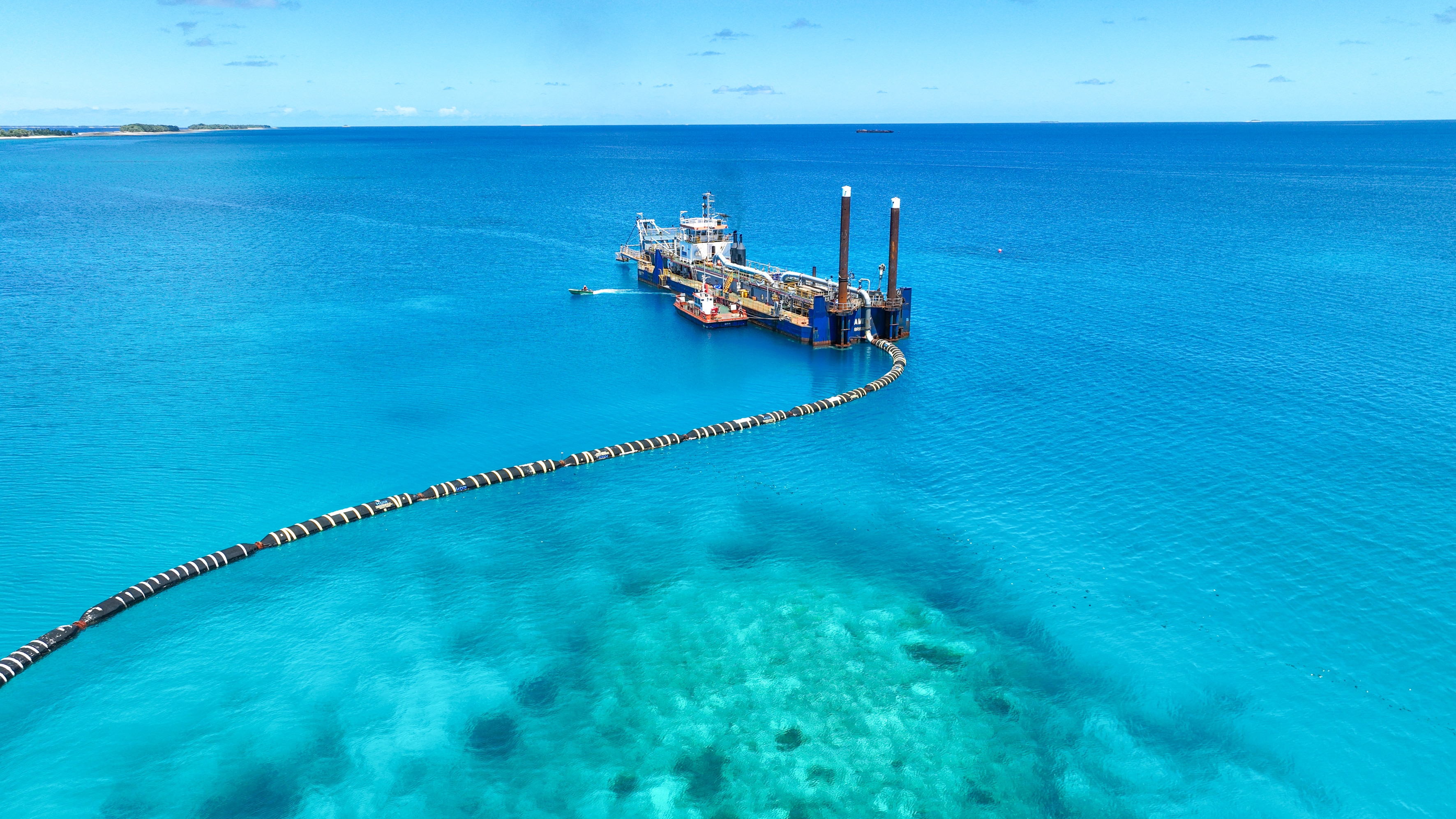 Around the capital Funafuti giant dredging ships vacuum sand from lagoon floors and pump it to elevate Tuvalu's shorelines.