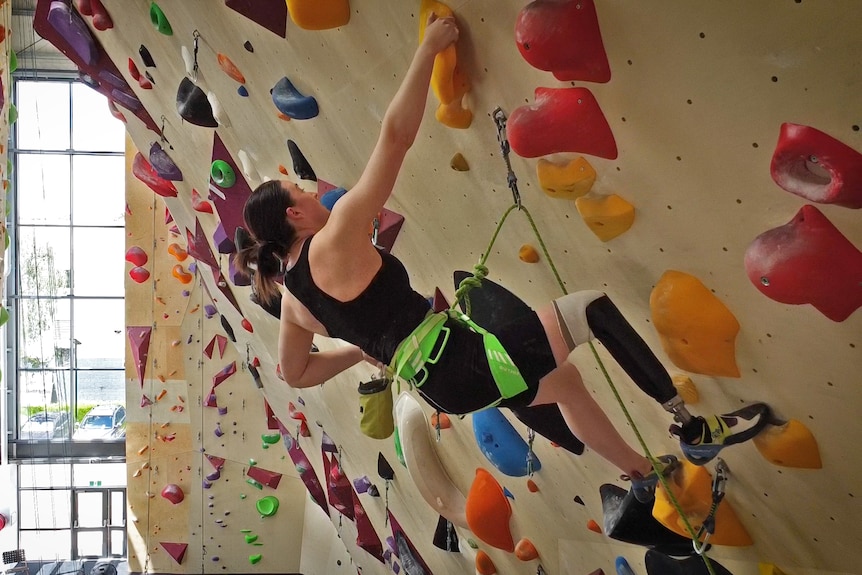 Australian paraclimber Sarah Larcombe climbs a wall at Urban Climb, Blackburn.