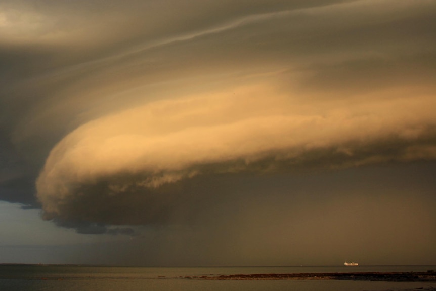 A storm front moves across Darwin Harbour at around 7pm.