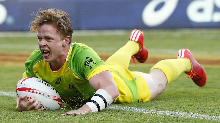 Teen spirit ... Henry Hutchison scores a try for Australia during the Sydney sevens in February