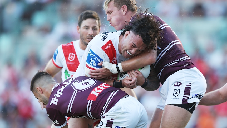 Jaydn Su’A of the Dragons is tackled by Ben Trbojevic of the Sea Eagles during the round four NRL match between St George Illawarra Dragons and Manly Sea Eagles at WIN Stadium, on March 30, 2024, in Wollongong, Australia.