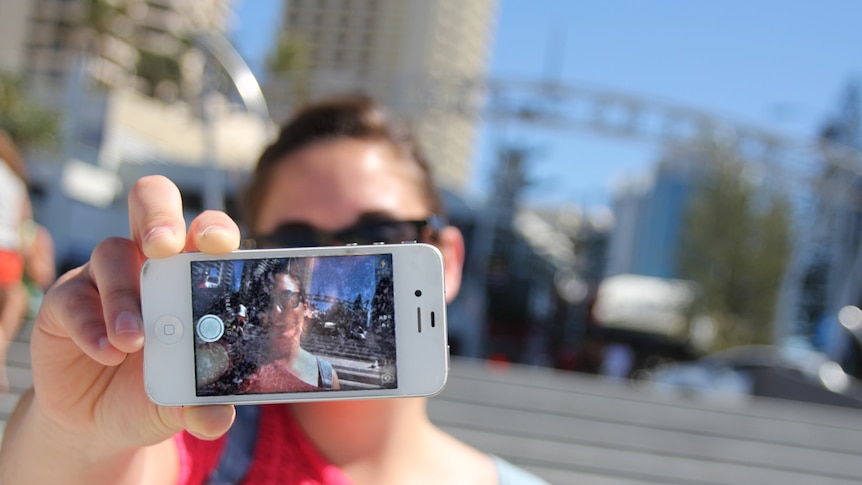 Tourist takes a selfie at Surfers Paradise, Gold Coast