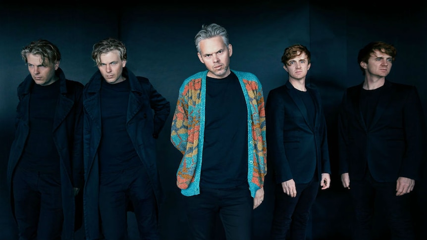 PNAU dressed in black, Nick Littlemore with colourful cardigan