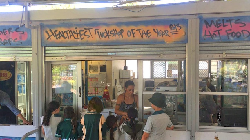 Kids line up at Coombabah State School tuckshop on the Gold Coast