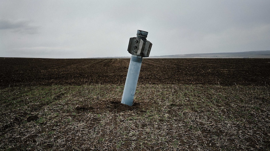 An unexploded rocket in field near the village of Dmitrivka.