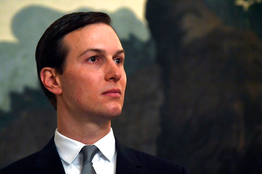 Jared Kushner wears a suit and a neutral expression, looking away from the direction of the camera.