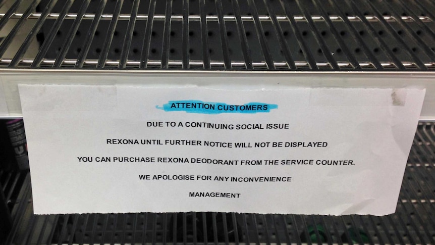 Sign in supermarket explaining removal of deodorant