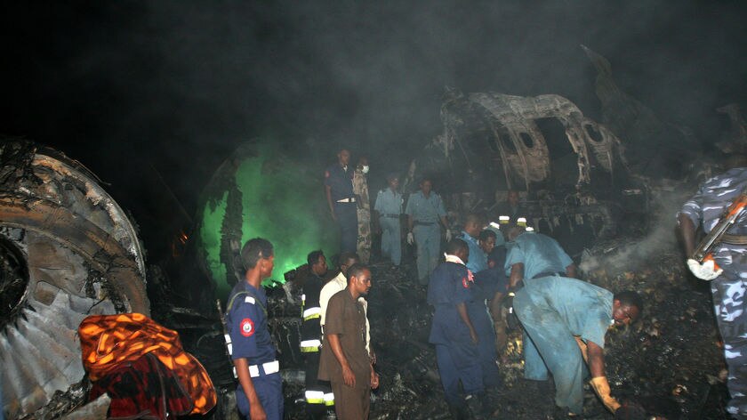 Rescue workers examine Sudan plane crash scene