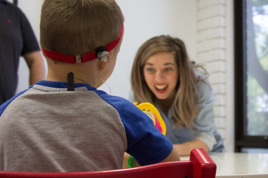 Samuel Koschel plays a game with his therapist Fiona