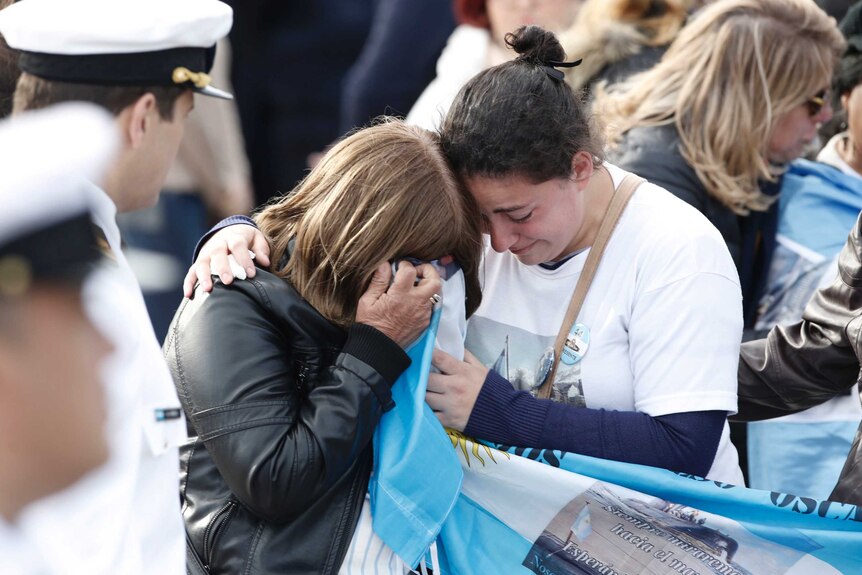 Relatives of the missing crew of the ARA San Juan submarine, embrace in mourning after a remembrance ceremony.