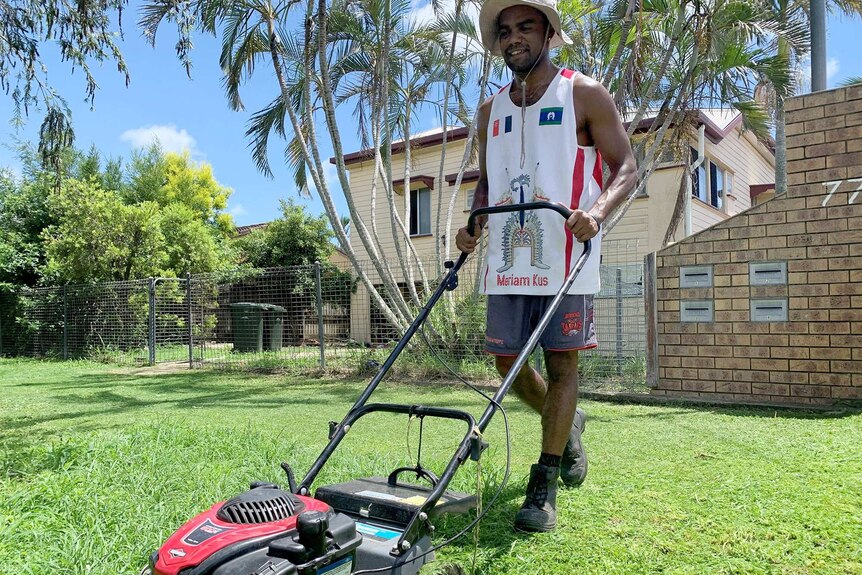 Man mowing lawn.