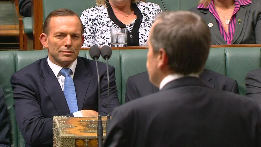Tony Abbott listens to Bill Shorten