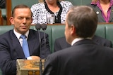 Tony Abbott listens to Bill Shorten