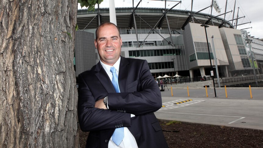 Mickey Arthur poses outside the MCG. Tall pic.