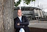 Mickey Arthur poses outside the MCG. Tall pic.