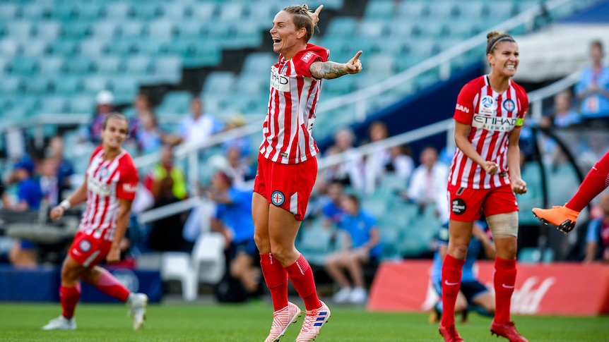 Jess Fishlock jumps in the air after the full-time whistle in Melbourne City's W-League grand final win.