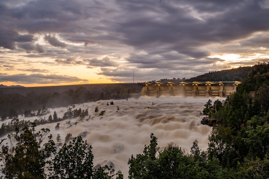 Water flowing over the dam wall