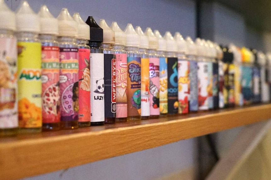 Vape paraphernalia lines a shelf in an inner-city vape bar in Jakarta, Indonesia.