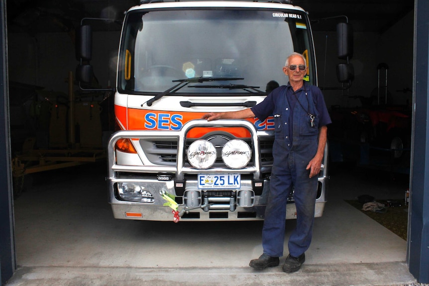 Ian 'Snow' Nielson standing in front of the SES truck in Smithton