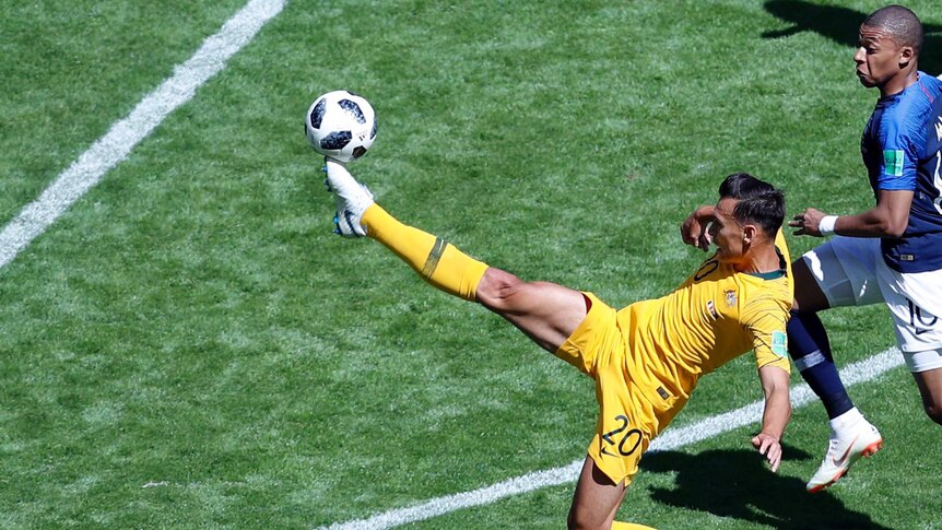 Trent Sainsbury kicks the ball with his right foot against France at the 2018 World Cup.