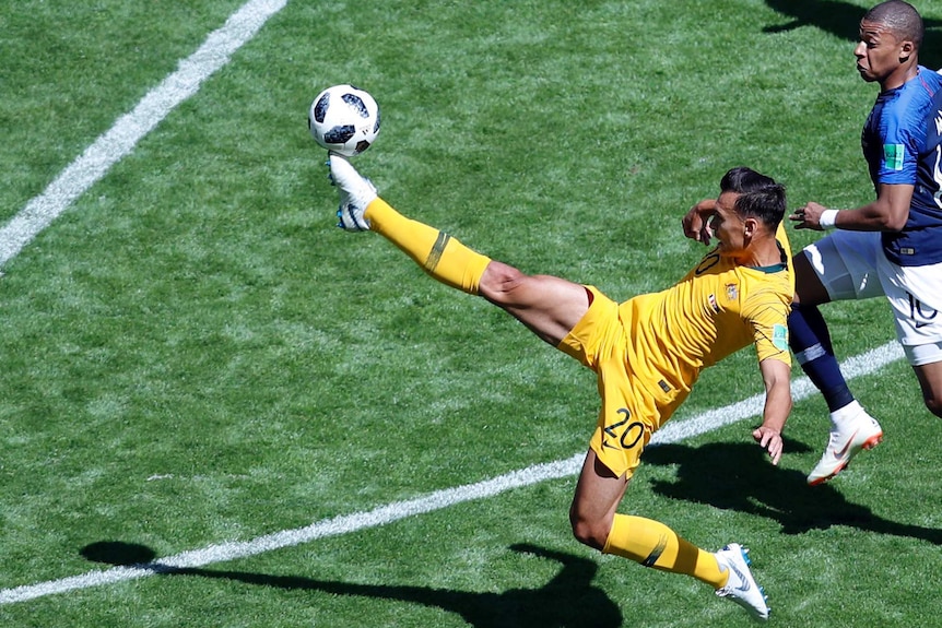 Trent Sainsbury kicks the ball with his right foot against France at the 2018 World Cup.