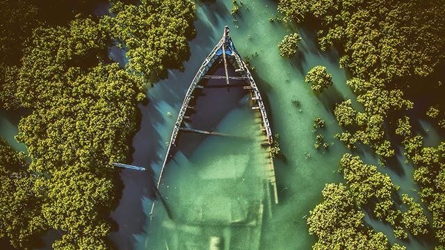 An aerial photo of a sunken boat.